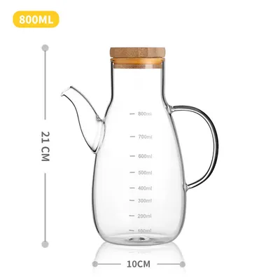 A glass oil can can be filled with oil cans