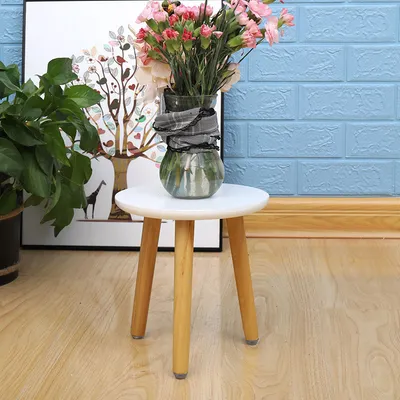 Simple Round Leg Craft Flower Stand On Wooden Balcony