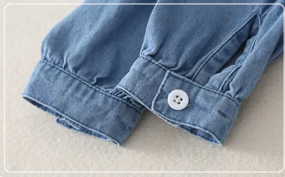 Girl baby jeans wear a triangular climbing suit