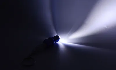 LED light spark plug keychain