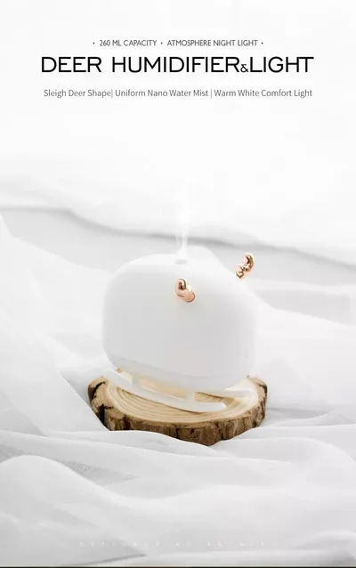 جهاز ترطيب وعلاج عطري صغير ومحمول يعمل بمنفذ USB بتصميم غزال وزلاجة