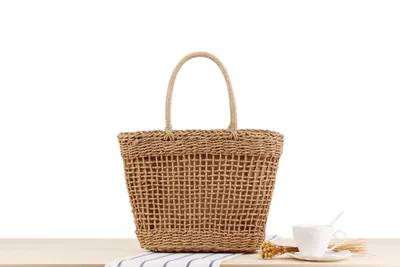 Hand-held New Hollow Woven Holiday Outing Straw Bag