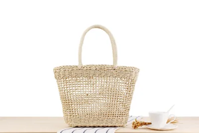 Hand-held New Hollow Woven Holiday Outing Straw Bag