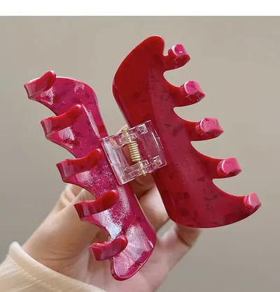 White Dragon Fruit Colored Hair Clip With A Spoon On The Back Of The Head