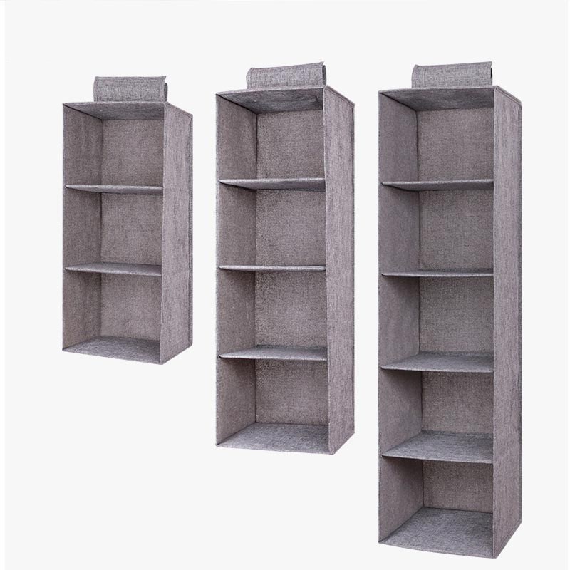 The linen cabinet contains hanging bags