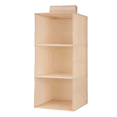 The linen cabinet contains hanging bags