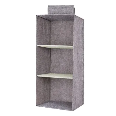The linen cabinet contains hanging bags
