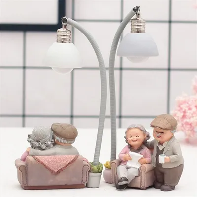 Grandma decorates the cake with a small night light