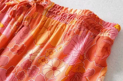 Ruffled Knotted Sling Top