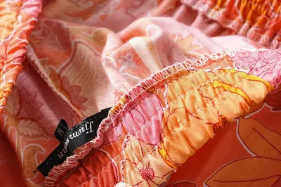 Ruffled Knotted Sling Top