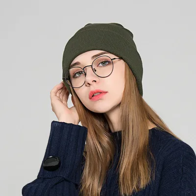 The new knitted woolen hat is thick and warm in solid color