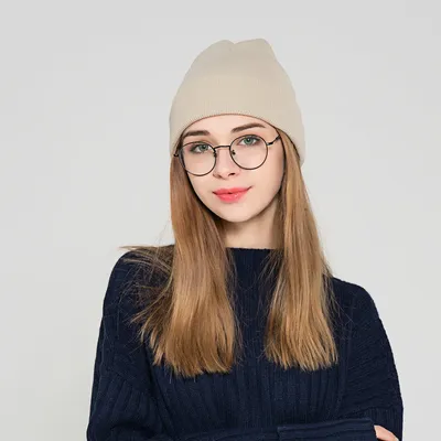 The new knitted woolen hat is thick and warm in solid color
