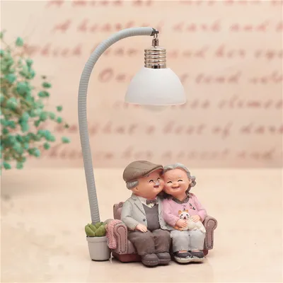 Grandma decorates the cake with a small night light