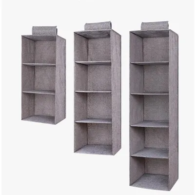 The linen cabinet contains hanging bags